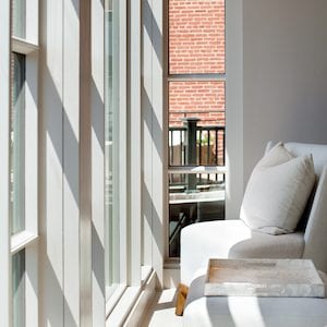 white couch overlooking windows at spa