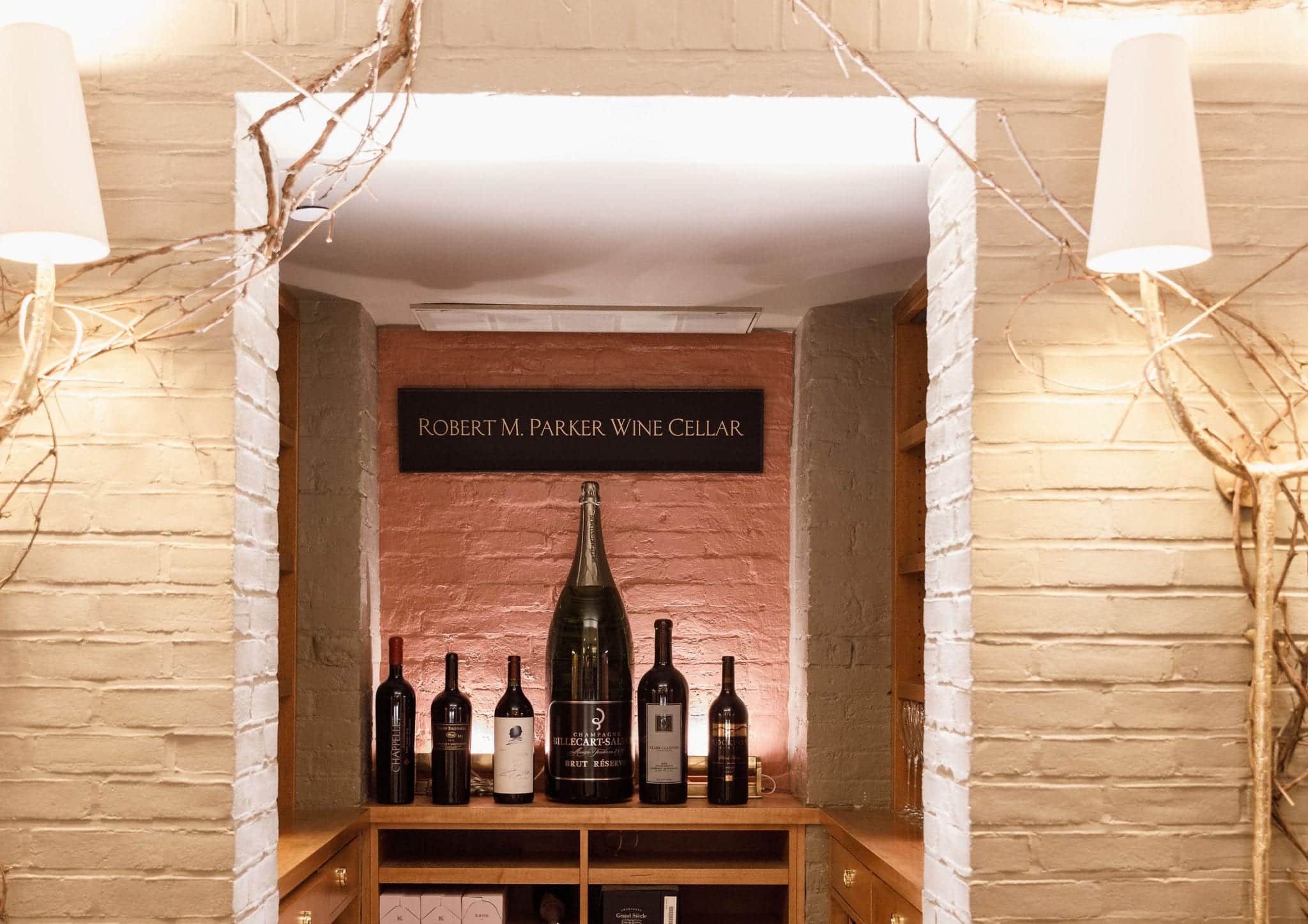 Wine on display under the Robert Parker Wine Cellar sign in Magdalena Restaurant.