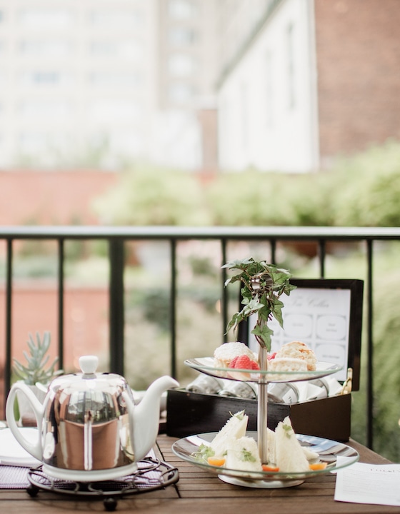 Teatime and pastries set up on balcony overlooking courtyard.