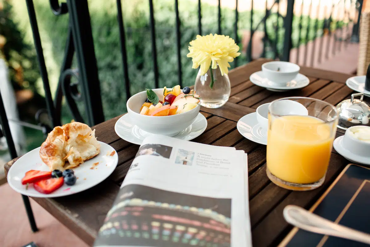 Breakfast spread outdoors on the terrace at The Ivy Hotel.