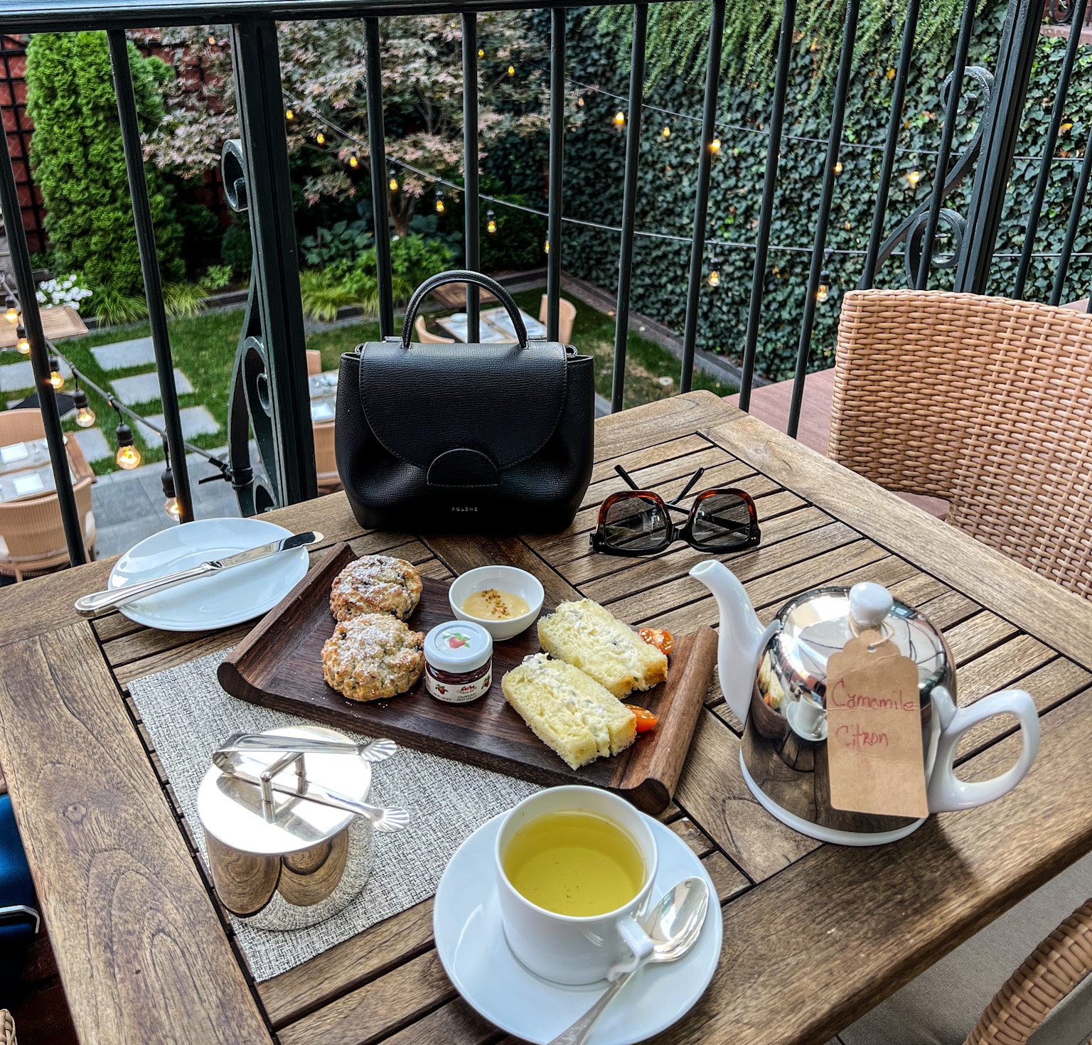 Tea set up on an outdoor terrace at The Ivy Hotel.